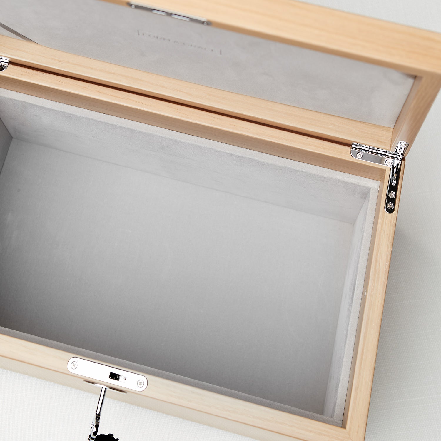 Wooden picture frame with a clear glass panel on a white background