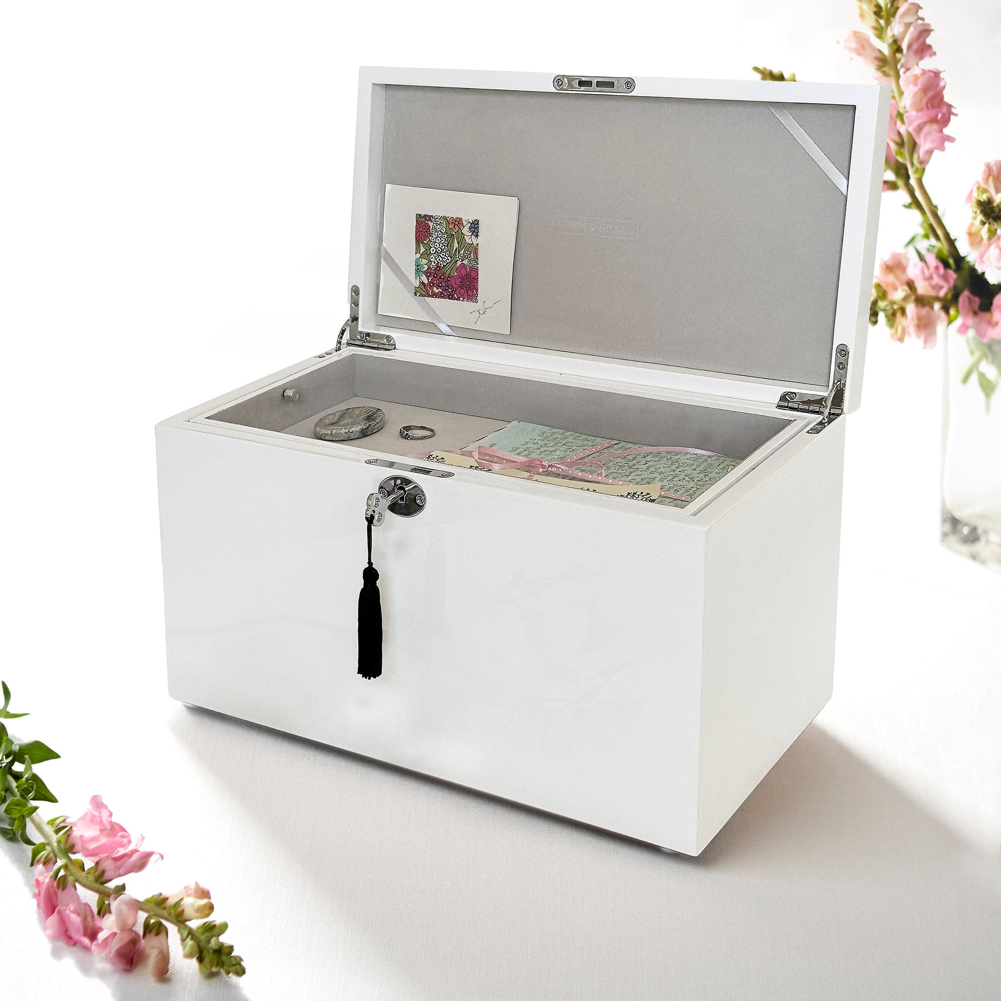 White jewelry box with open lid on a white background